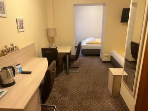 Postel nebo postele na pokoji v ubytování M&M Hotel - Seevetal