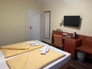 Postel nebo postele na pokoji v ubytování M&M Hotel - Seevetal