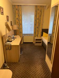 Postel nebo postele na pokoji v ubytování M&M Hotel - Seevetal