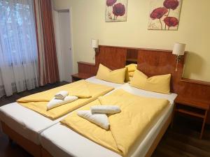 Postel nebo postele na pokoji v ubytování M&M Hotel - Seevetal