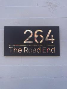 a sign on a wall that reads the road end at 264 The Road End in Liverpool
