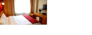 Postel nebo postele na pokoji v ubytování Cetinkaya Hotel