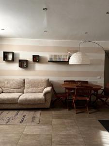 a living room with a couch and a table at Marilù in Palermo