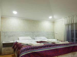 Postel nebo postele na pokoji v ubytování GUEST HOUSE 15A