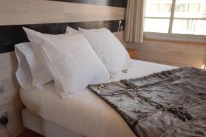 Ένα ή περισσότερα κρεβάτια σε δωμάτιο στο Hotel des Pyrénées