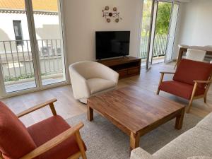 Zona de estar de Magnifique appartement climatisé de 87m², à 100m de la plage