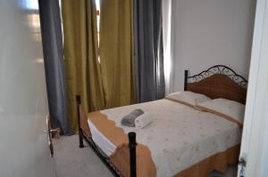 Postel nebo postele na pokoji v ubytování Plateau Apartment