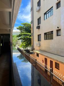 a view of a river between two buildings at Nosso apê no Guarujá - Unidade Aquário in Guarujá