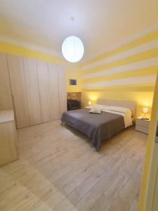A bed or beds in a room at Tecla House