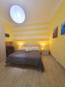 A bed or beds in a room at Tecla House