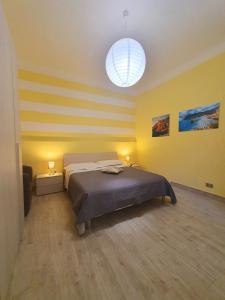 A bed or beds in a room at Tecla House