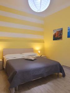 A bed or beds in a room at Tecla House