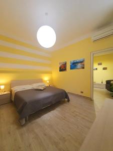 A bed or beds in a room at Tecla House