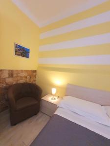 A bed or beds in a room at Tecla House