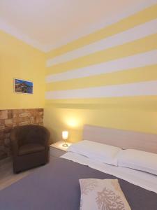 A bed or beds in a room at Tecla House
