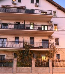 an apartment building with balconies on the side of it at SGB Apartment in Timişoara