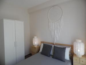 Ein Bett oder Betten in einem Zimmer der Unterkunft Apartamentos San Miguel
