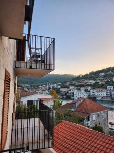 a balcony of a building with a view of a river at Apartment Bety, Stomorska, Solta in Stomorska