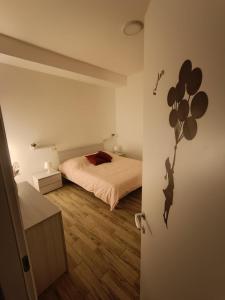 a bedroom with a bed with balloons on the wall at Casa No-Vi in Rome