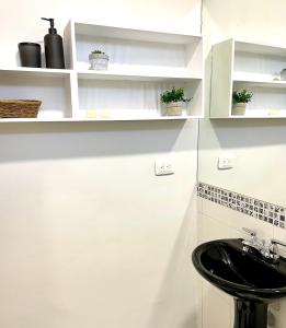 A cozinha ou cozinha compacta de Puesta del Sol Guest House
