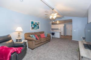 a living room with a couch and a table at Work Remote - minutes to I-27/I-40/Downtown in Amarillo