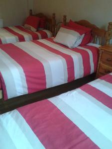 A bed or beds in a room at Nite Inn Bed & Breakfast 