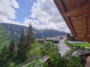 a view of a village with mountains in the background at Appartement Gsaller in Hopfgarten in Defereggen