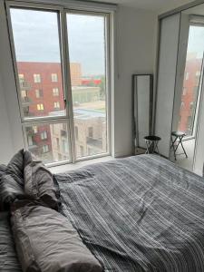 Postel nebo postele na pokoji v ubytování Modern 1 Bedroom apartment in Docklands (Gallions Reach)