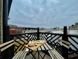 a plate of food on a table on a balcony at City Centre Gem in Southend near the beach, station and parking in Southend-on-Sea