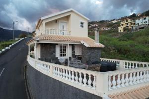 a small house on the side of a road at Levada Nova House in Ribeira Brava
