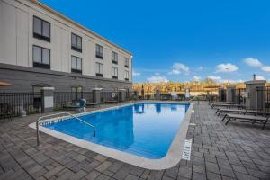 a large swimming pool in front of a building at Holiday Inn Express Hotel & Suites Perry by IHG in Perry