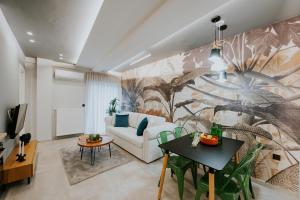 a living room with a couch and a table at Adastro Apartment 17 in Thessaloniki
