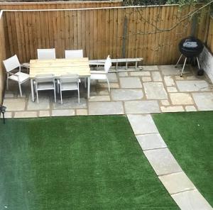 a patio with a bench and a grill and grass at Spacious 2 Bed, Free Parking, Free Wifi - Serene Homes Sheffield in Hillsborough