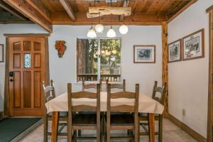 a dining room with a table and chairs at Clark Cabin in Yosemite West