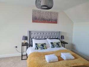 a bedroom with a bed with two pillows on it at The Appleleaf with Free Parking in Barton upon Humber