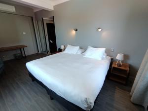 Rúm í herbergi á Hotel Enjoy Pucón