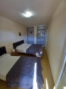 A bed or beds in a room at Rosesapparts Gran Via
