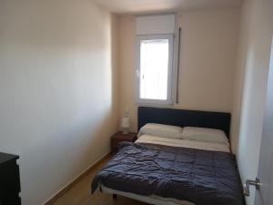 A bed or beds in a room at Rosesapparts Gran Via