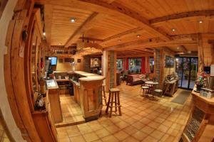 an overhead view of a kitchen and living room in a log cabin at Fleur des Neiges in Morzine