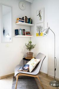 a chair with a pillow on it in a room at Las Americas studio in Playa de las Americas