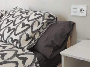 Posteľ alebo postele v izbe v ubytovaní Apartamentos Carrillo 4 Ático