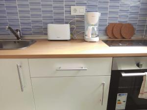 Kuchyňa alebo kuchynka v ubytovaní Apartamentos Carrillo 4 Ático