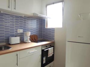 Kuchyňa alebo kuchynka v ubytovaní Apartamentos Carrillo 4 Ático