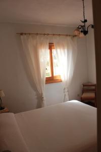 Posteľ alebo postele v izbe v ubytovaní Ca na Lidia d'en Carlos. Casa Petita