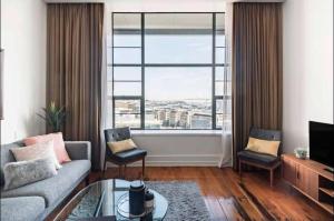 O zonă de relaxare la 1 Bedroom Apartment in CBD