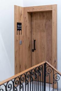 a wooden door with a sign in front of it at Buranelli Charme Rooms in Treviso +46 photos