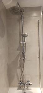 a shower in a bathroom with a sink and a shower at Stunning 3 bed House sleeps 5-6, WiFi, OFF Street Parking in Nottingham close to M1 in Nottingham +15 photos