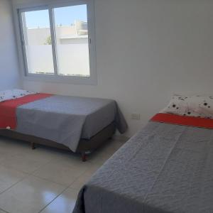 Postel nebo postele na pokoji v ubytování LC 1706 - Dpto. zona Costa del Limay