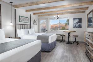 a hotel room with two beds and a window at Sky Ranch Lodge in Sedona