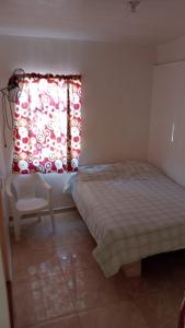 Postel nebo postele na pokoji v ubytování Hotel Rocio